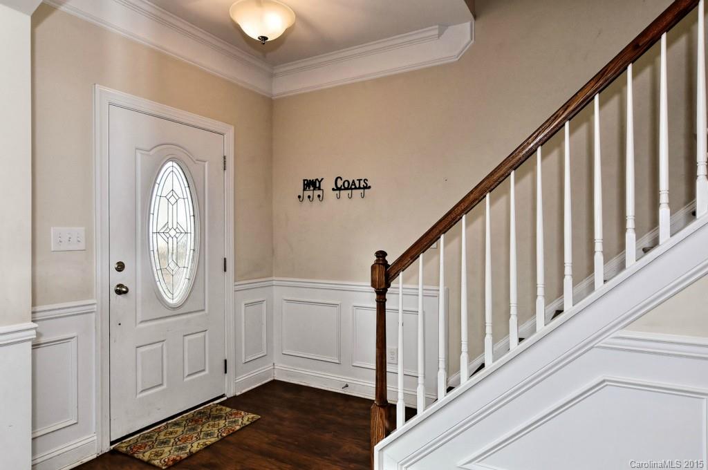 1004 Ridgehaven Road Waxhaw, NC 28173 - Photo 2 of 24 a view of a hallway with wooden floor and entryway
