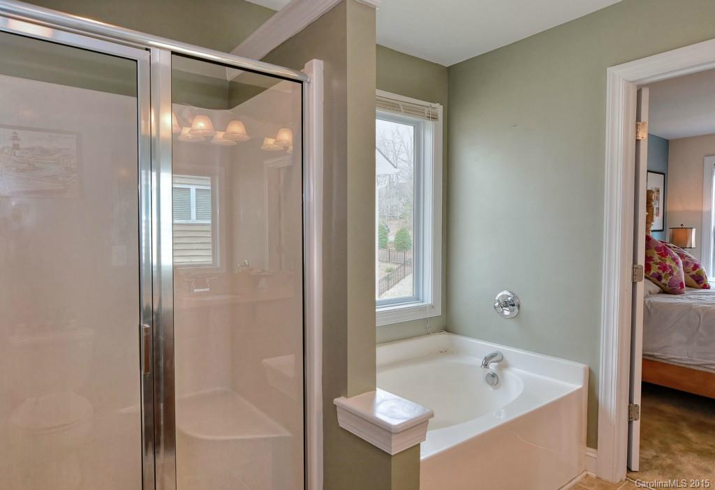 1004 Ridgehaven Road Waxhaw, NC 28173 - Photo 11 of 24 a bathroom with a tub and shower