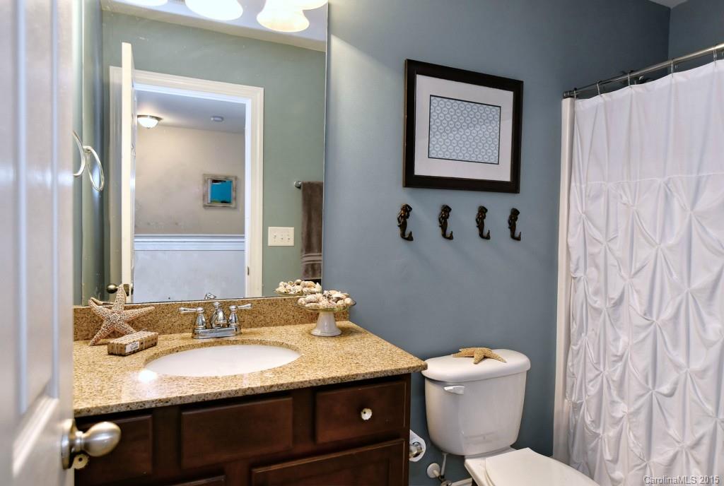 1004 Ridgehaven Road Waxhaw, NC 28173 - Photo 14 of 24 a bathroom with a granite countertop sink and a mirror