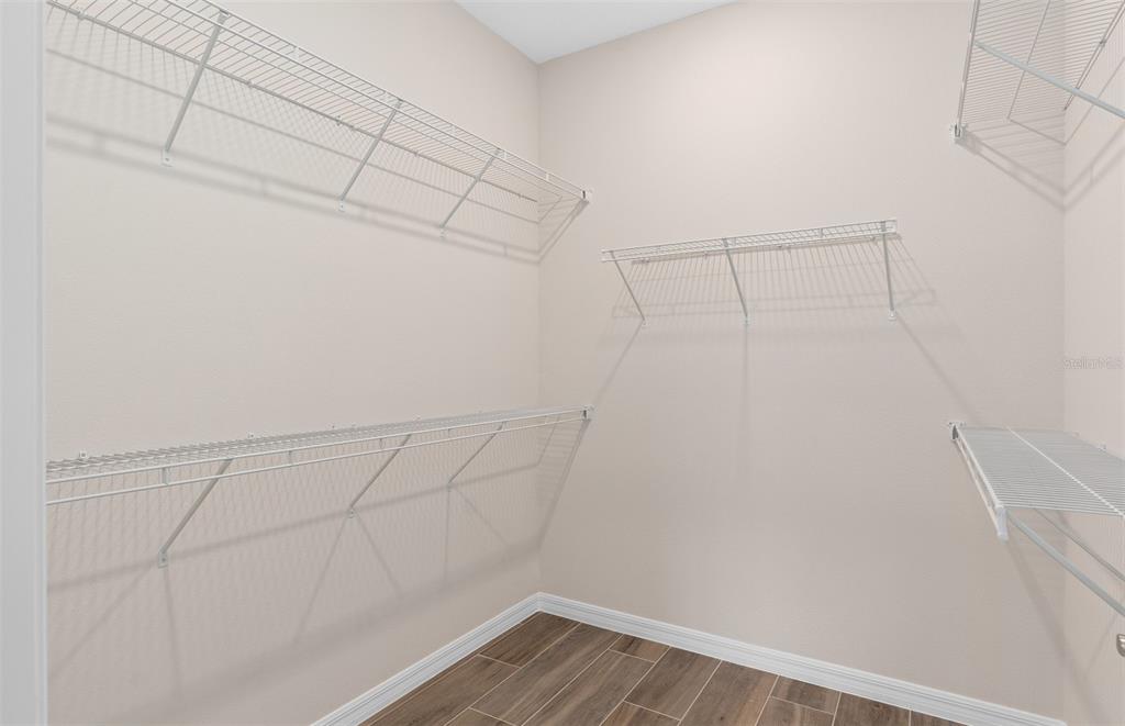 1175 Crowning Rdg Way Minneola, FL 34715 - Photo 17 of 23 a view of a room with racks on the wall