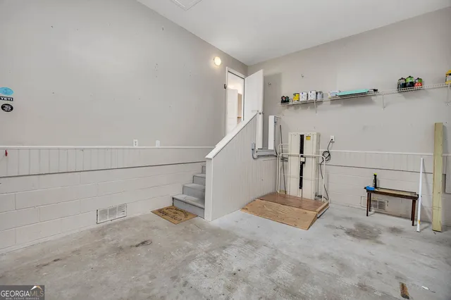 a view of a garage with rack and bicycle