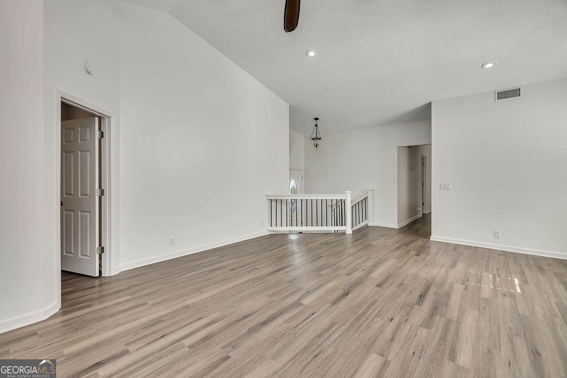 3 Bay Tree Court West St. Simons, GA 31522 - Photo 9 of 36 a view of an empty room with wooden floor and a window