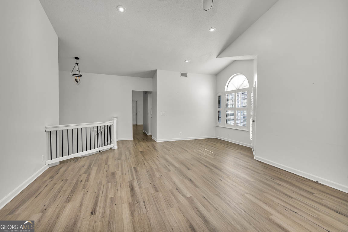 3 Bay Tree Court West St. Simons, GA 31522 - Photo 10 of 36 wooden floor in an empty room with a window