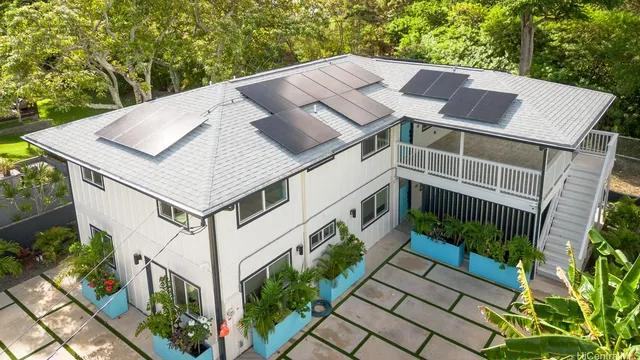 a aerial view of a house with a yard
