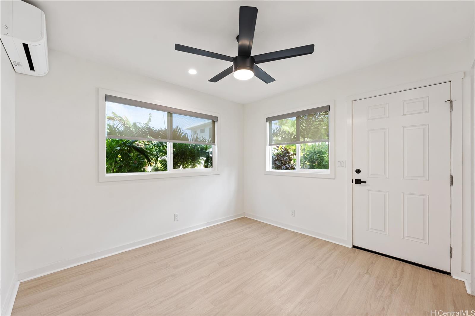 437 Kawailoa Road Kailua, HI 96734 - Photo 6 of 16 a view of empty room with wooden floor and fan