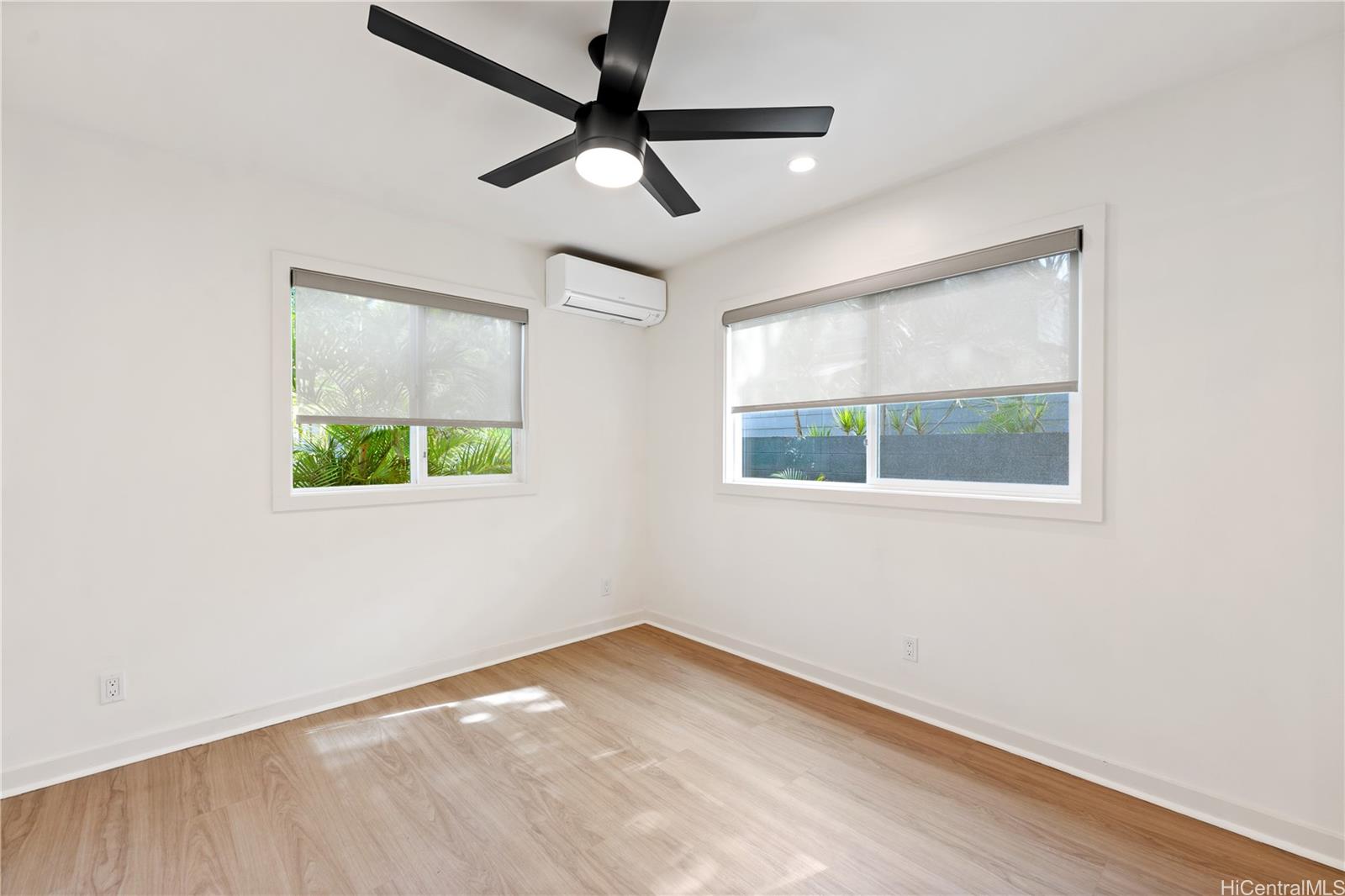 437 Kawailoa Road Kailua, HI 96734 - Photo 9 of 16 an empty room with a window and ceiling fan