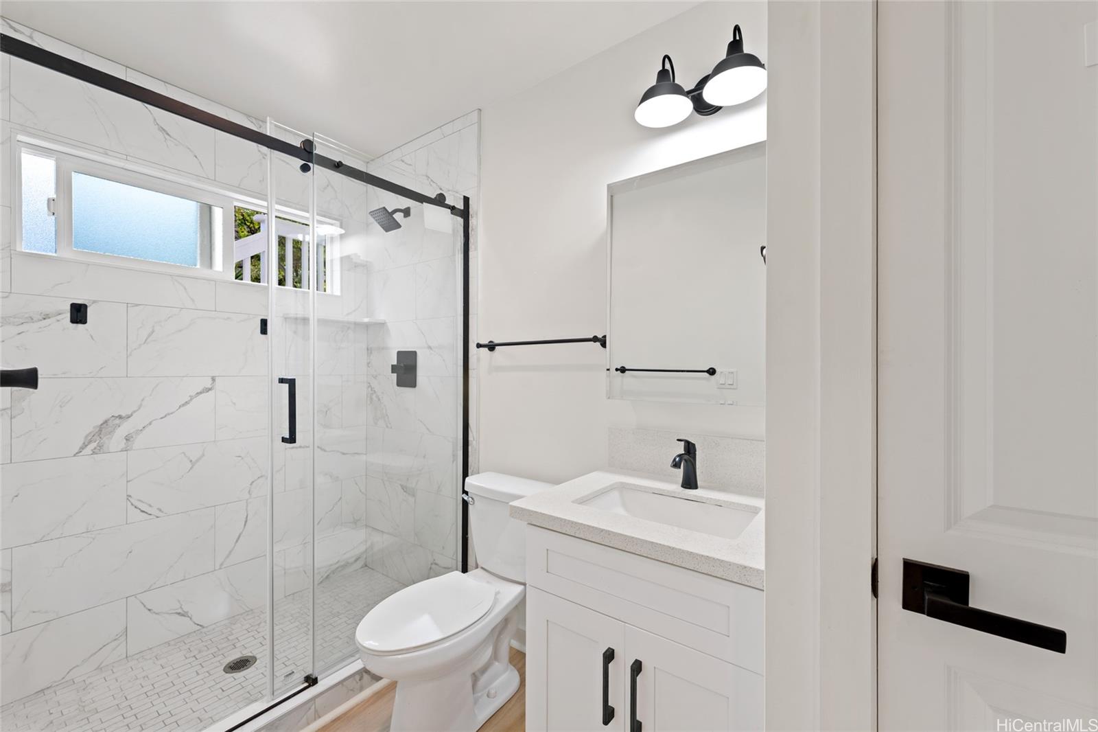 437 Kawailoa Road Kailua, HI 96734 - Photo 10 of 16 a bathroom with a sink a toilet and shower