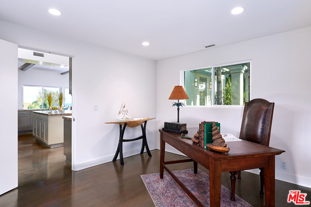 28907 Wight Road Malibu, CA 90265 - Photo 28 of 54 a view of a workspace with furniture and a potted plant