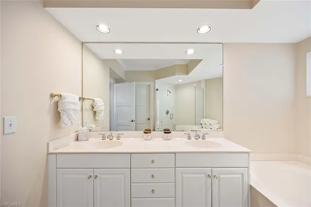 a bathroom with a sink vanity and a mirror