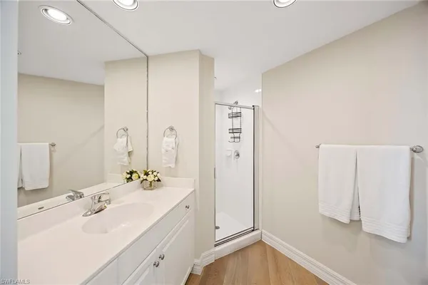 a bathroom with a double vanity sink mirror and