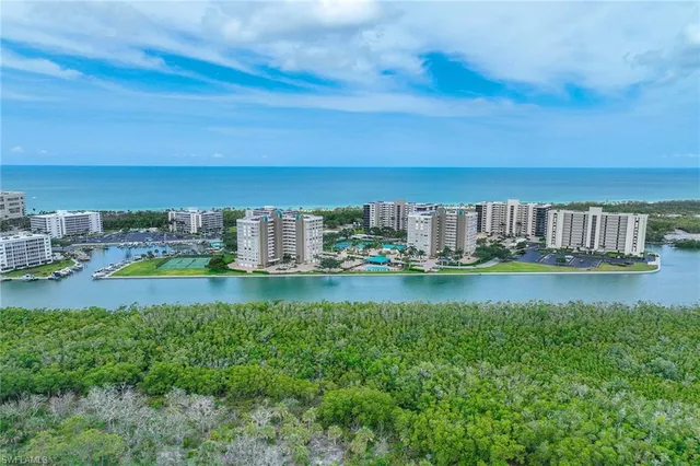 a view of a city with tall buildings and a big yard