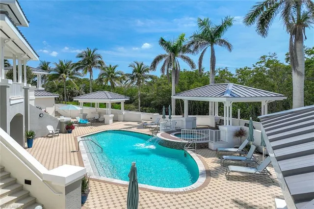 a patio with a table and chairs