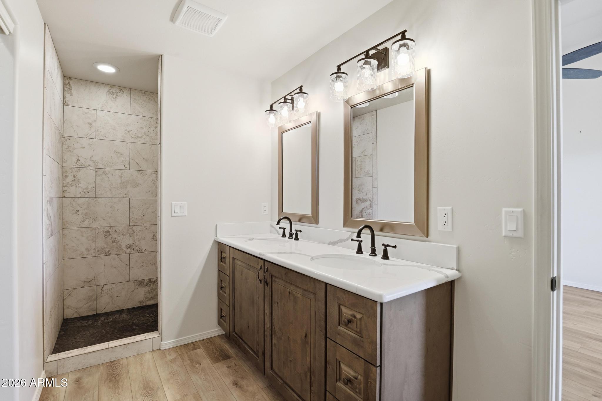 1908 East Starlight Pass Payson, AZ 85541 - Photo 24 of 30 a bathroom with a double vanity sink mirror and shower
