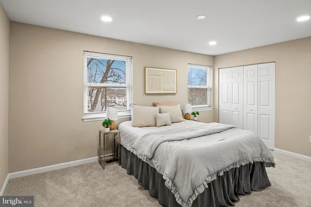 a picture of a bench in front of a wall