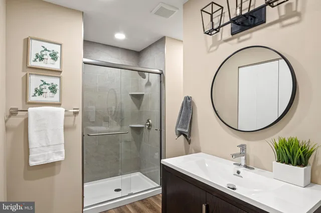 a view of a workspace with furniture and wooden floor