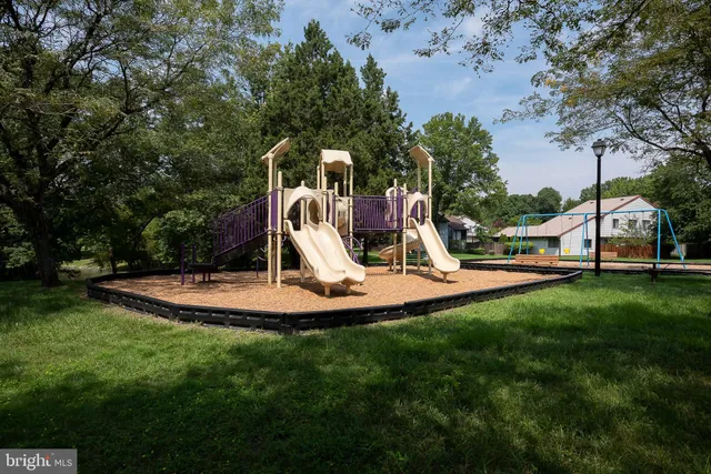 a backyard of a house with wooden fence