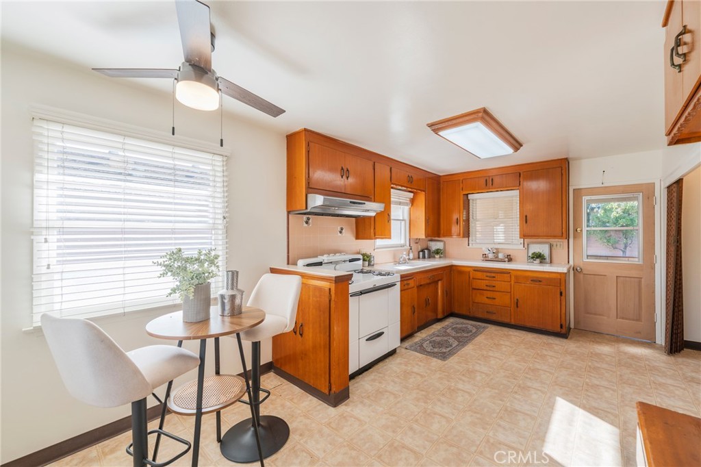 1241 South Walnut Street Anaheim, CA 92802 - Photo 13 of 36 a kitchen with a window and chairs