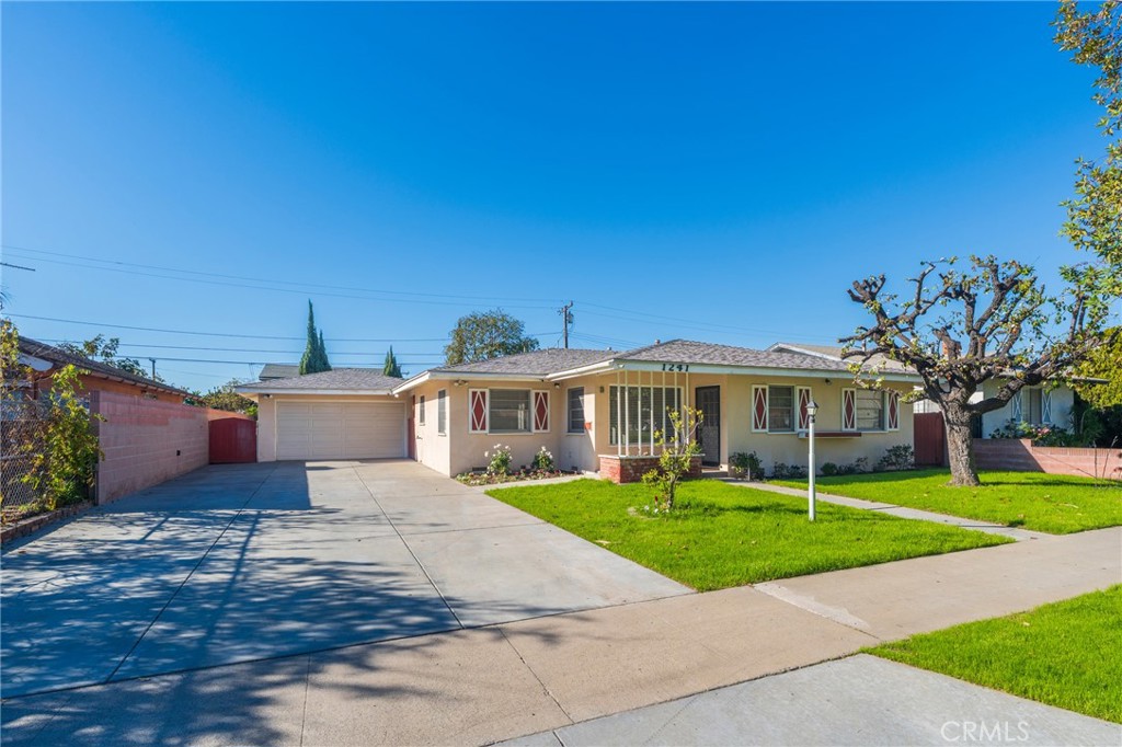 1241 South Walnut Street Anaheim, CA 92802 - Photo 2 of 36 a view of a house with a yard and potted plants