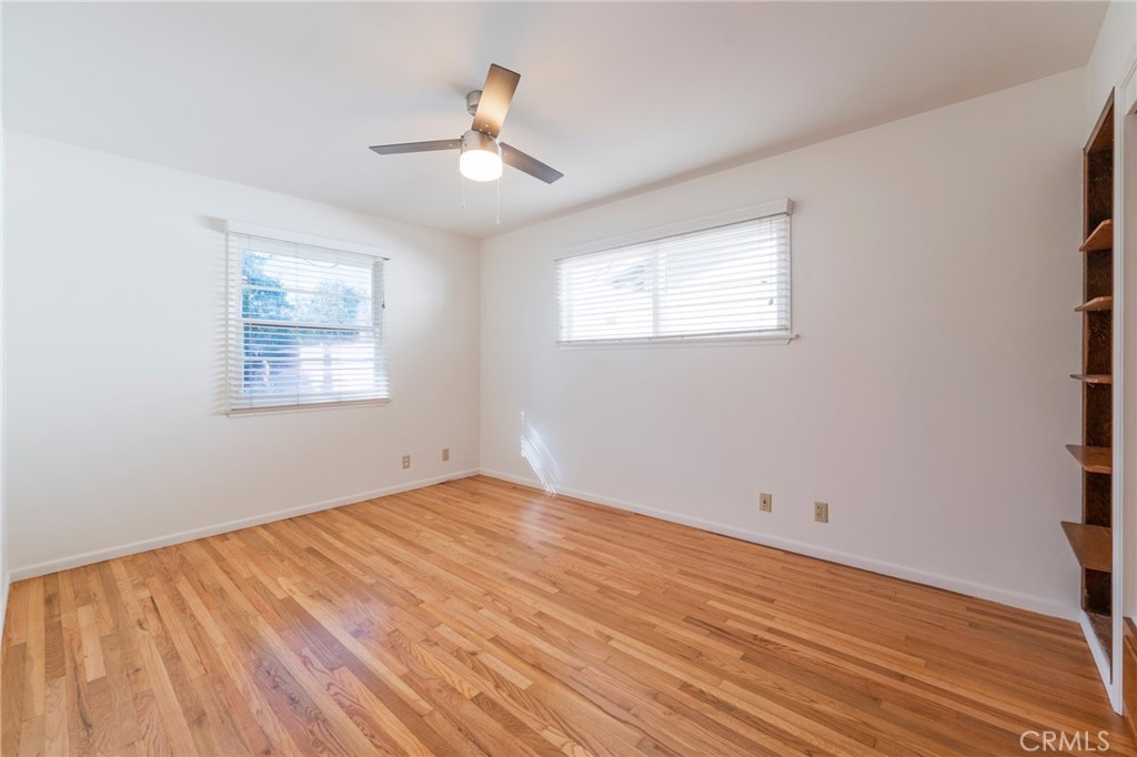 1241 South Walnut Street Anaheim, CA 92802 - Photo 22 of 36 a view of an empty room with wooden floor and a window