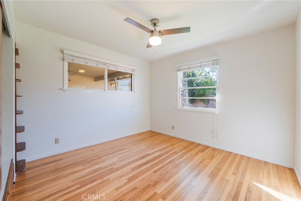 1241 South Walnut Street Anaheim, CA 92802 - Photo 24 of 36 a view of empty room with wooden floor and ceiling fan