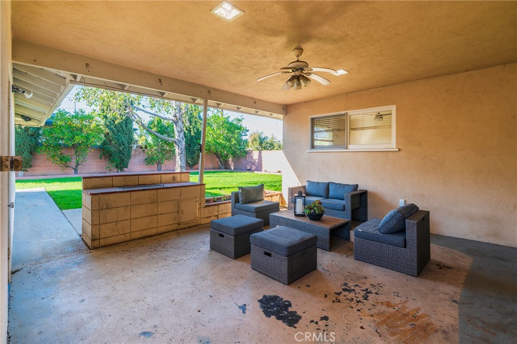 1241 South Walnut Street Anaheim, CA 92802 - Photo 31 of 36 a living room with furniture and a floor to ceiling window