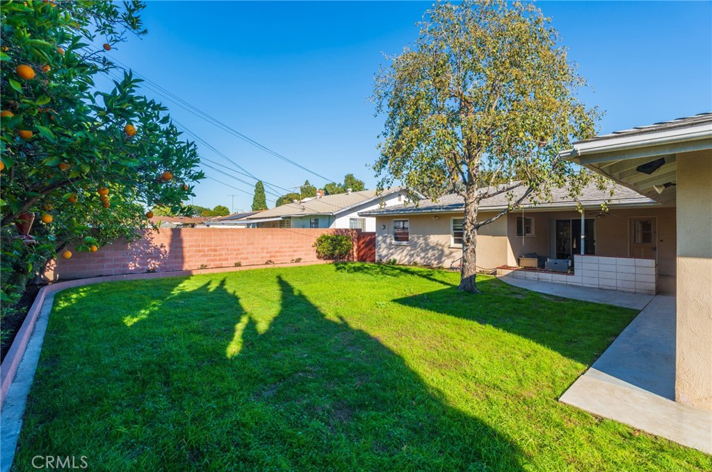 1241 South Walnut Street Anaheim, CA 92802 - Photo 33 of 36 a view of a yard with table and chairs and a barbeque