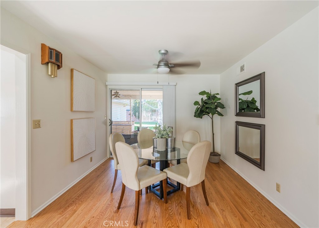 1241 South Walnut Street Anaheim, CA 92802 - Photo 9 of 36 a view of a dining room with furniture window and wooden floor