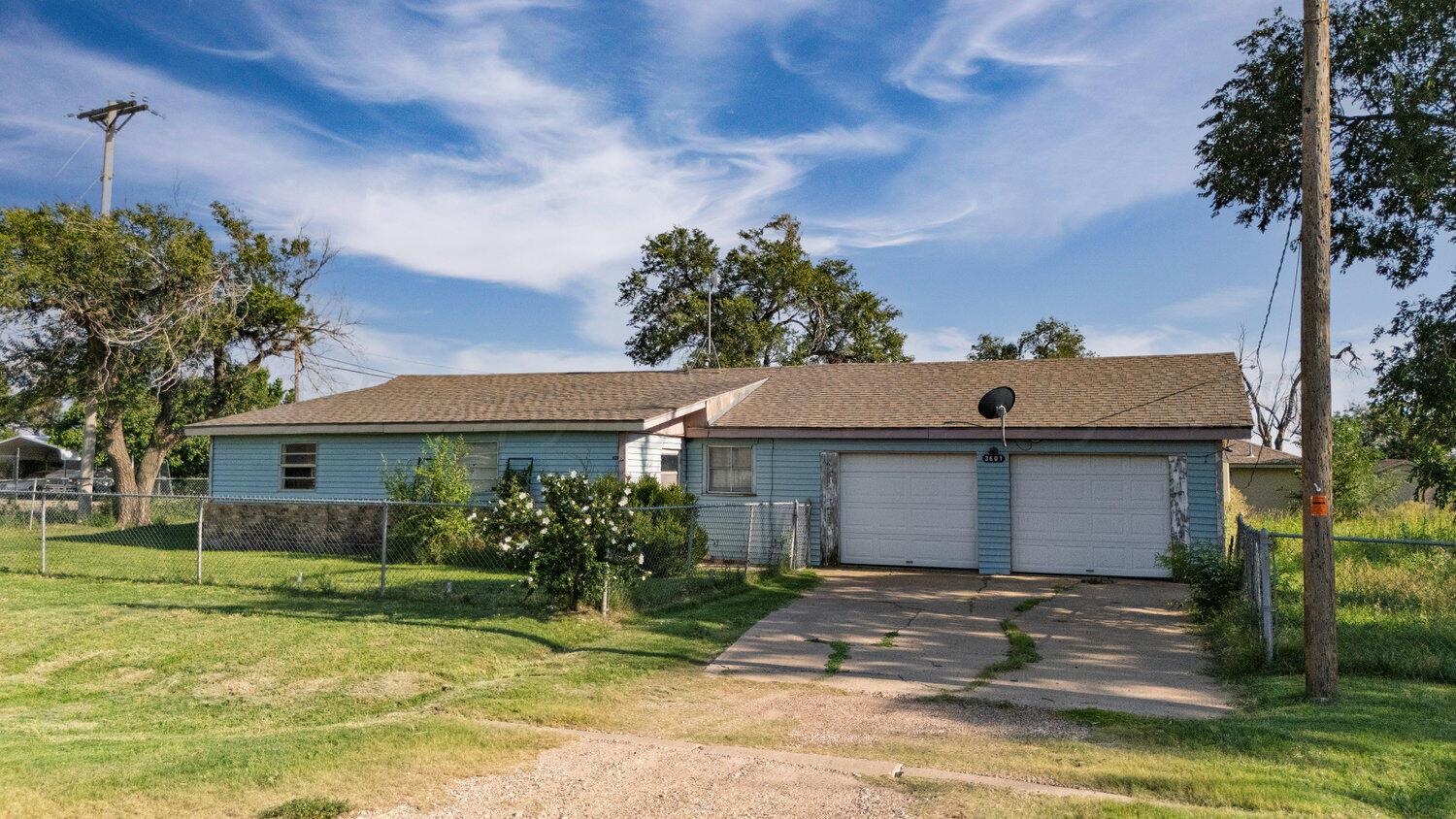 3601 Beacon Road Amarillo, TX 79118 - Photo 2 of 15 a front view of a house with a garden