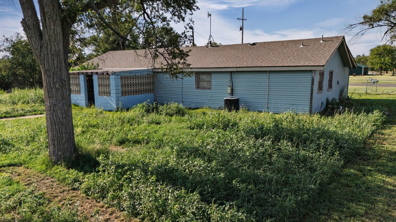 3601 Beacon Road Amarillo, TX 79118 - Photo 3 of 15 a aerial view of a house with a yard and potted plants