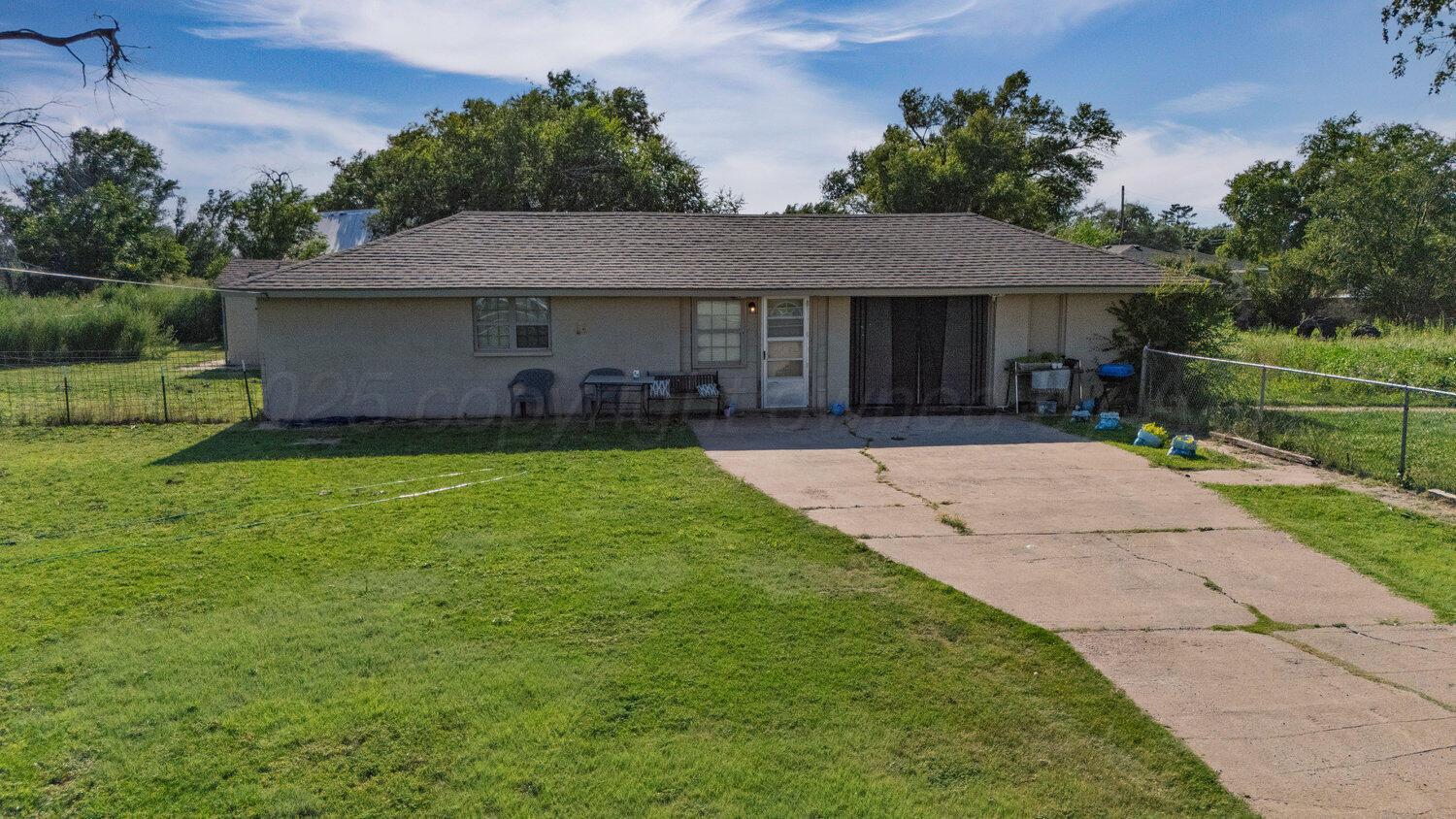 3601 Beacon Road Amarillo, TX 79118 - Photo 6 of 15 a front view of a house with a yard