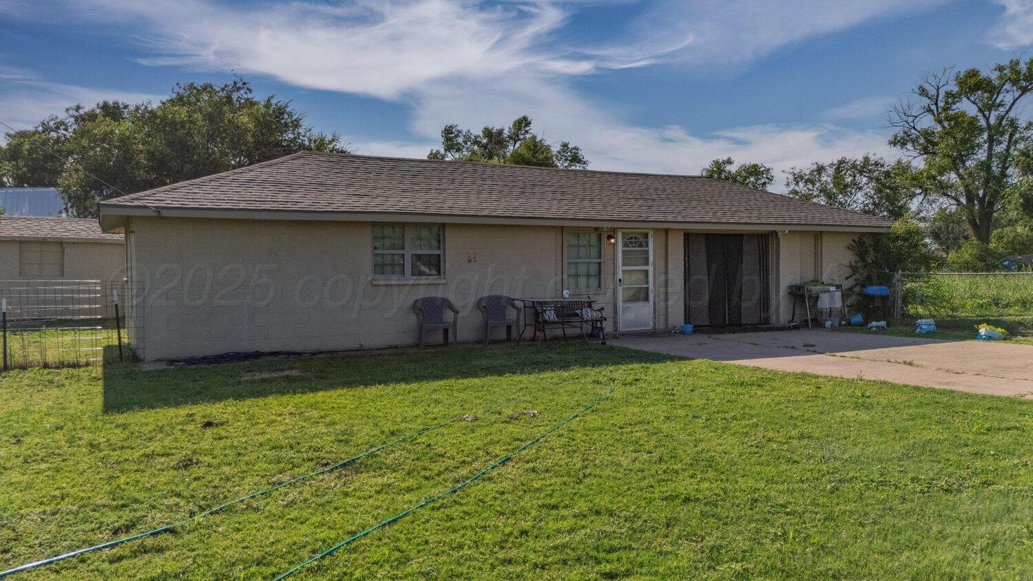 3601 Beacon Road Amarillo, TX 79118 - Photo 9 of 15 a backyard of a house with yard and outdoor seating