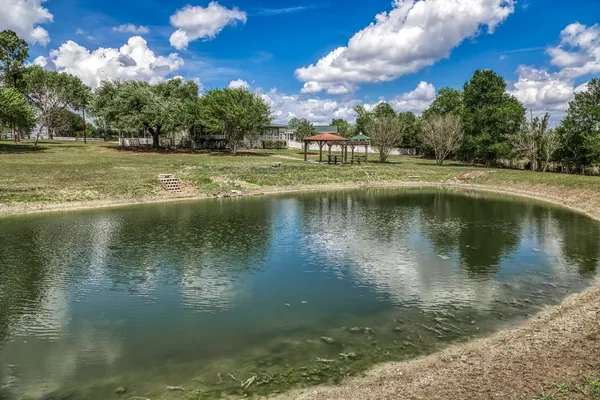 a view of a golf course with a lake
