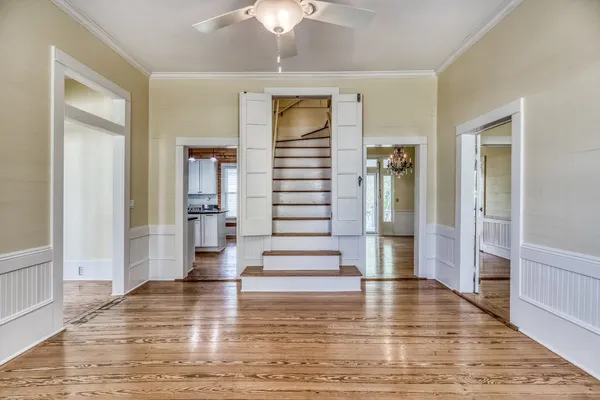 a view of kitchen with livingroom and wooden floor