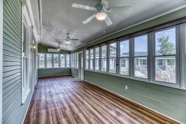 a view of a wooden deck with a bench