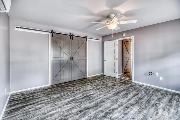 a kitchen with stainless steel appliances granite countertop a stove refrigerator and cabinets