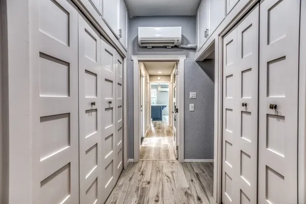 a kitchen with kitchen island granite countertop a stove and a sink