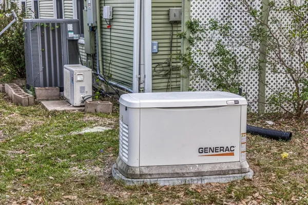 a view of a house with a backyard and a trees