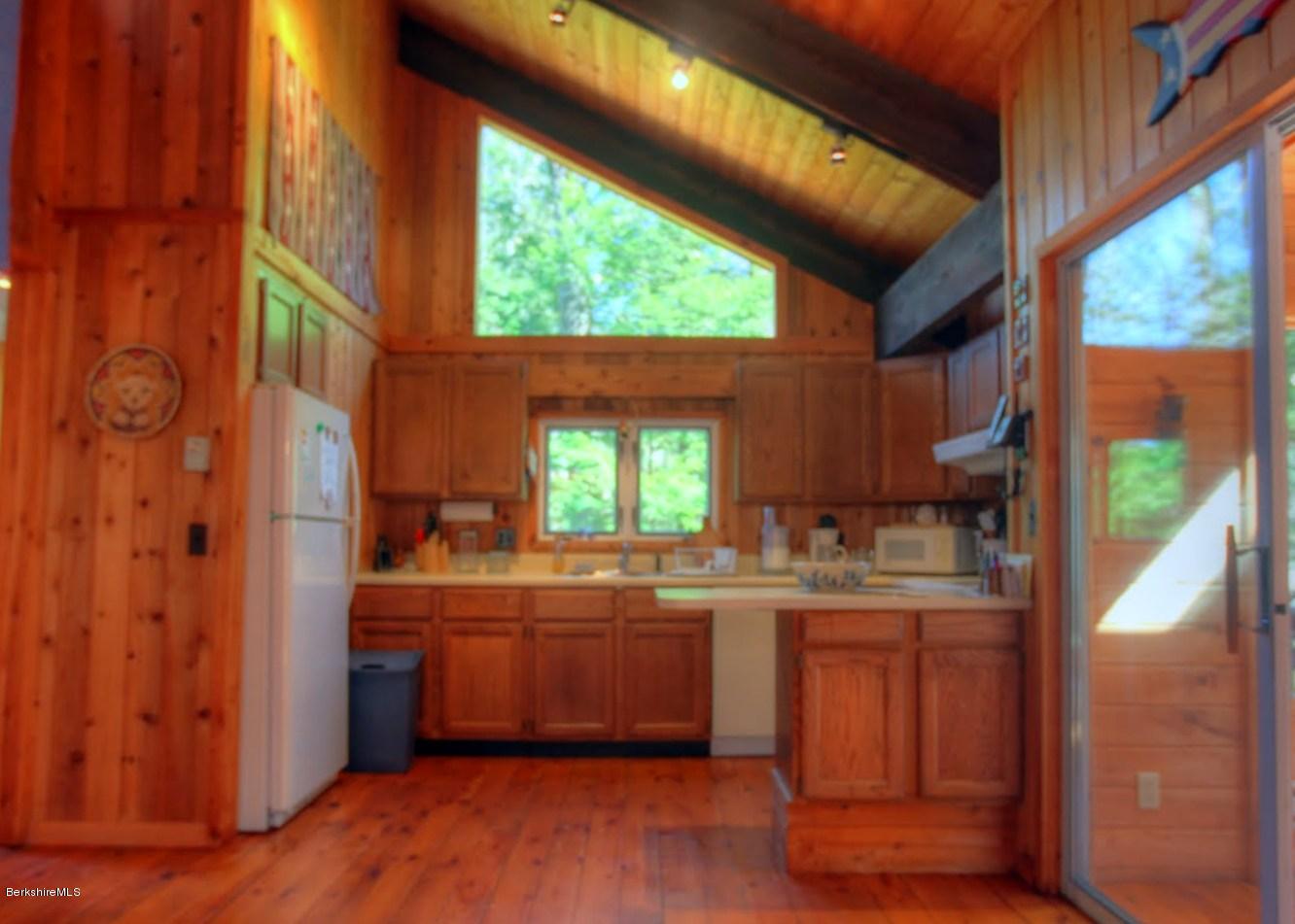 145 Town Hill Road Sandisfield, MA 01255 - Photo 8 of 26 a kitchen with stainless steel appliances a sink a stove and a refrigerator