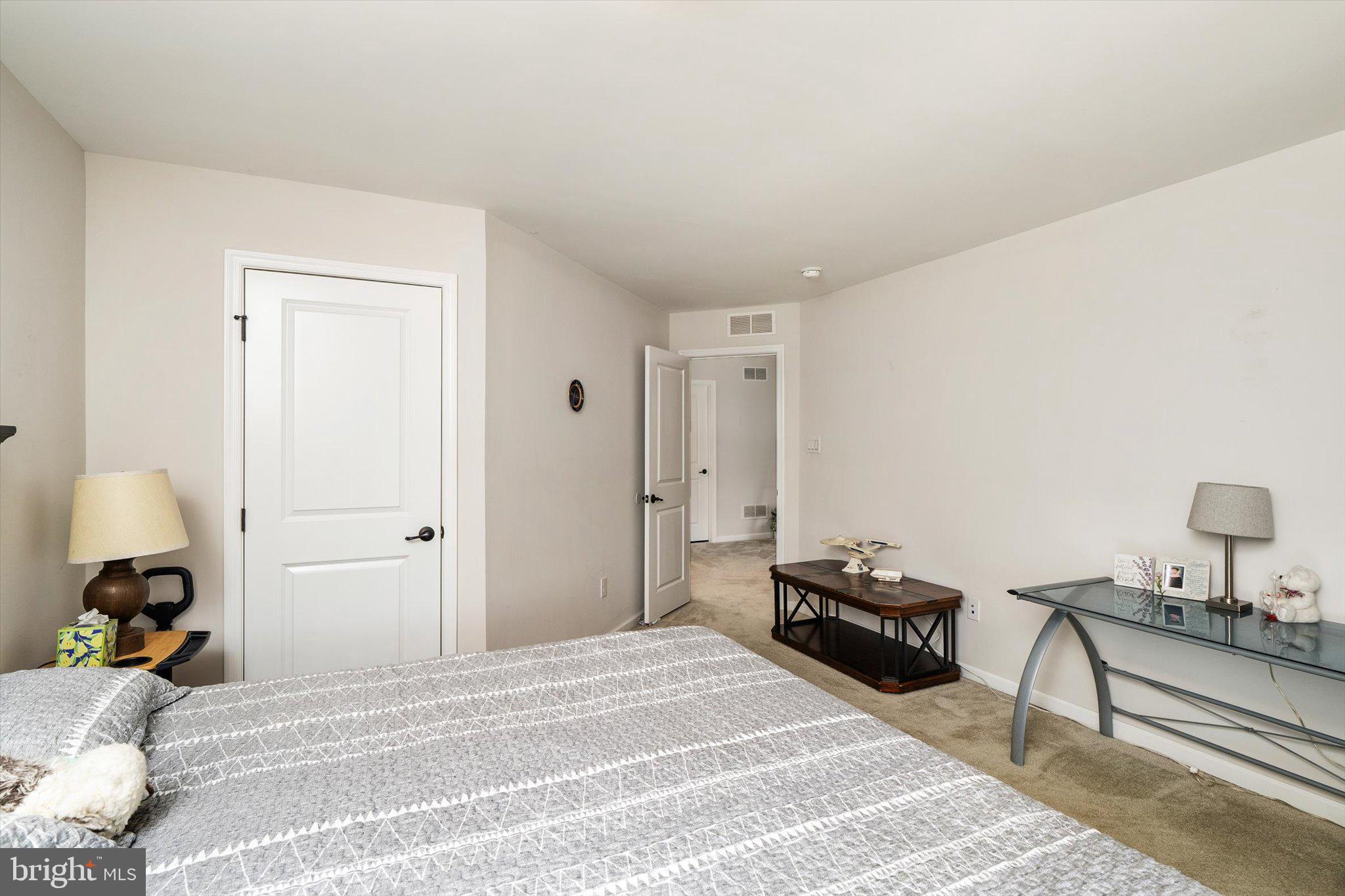 84 Heals Farm Road Burlington, NJ 08016 - Photo 23 of 33 a bedroom with a bed and a lamp