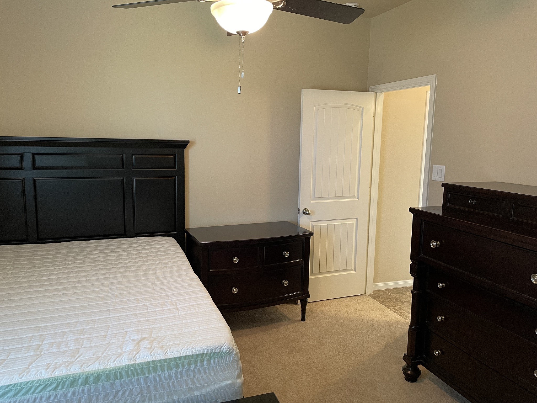 9111 Turnbull Lane Rosenberg, TX 77469 - Photo 17 of 29 a bedroom with a bed and a dresser