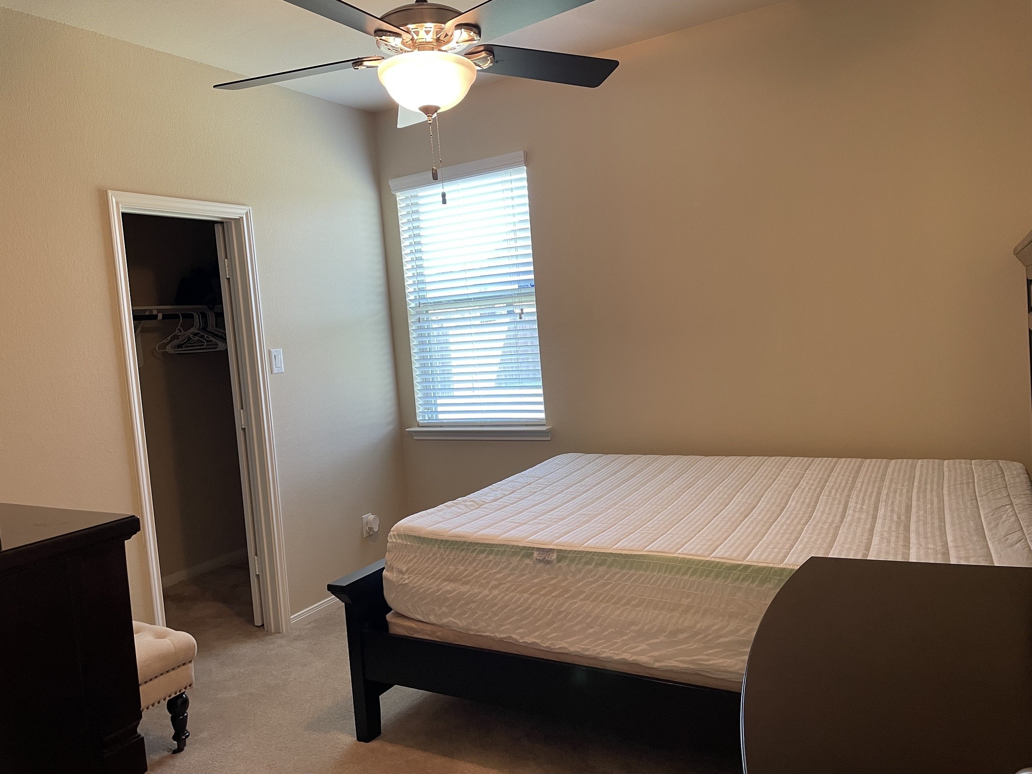 9111 Turnbull Lane Rosenberg, TX 77469 - Photo 18 of 29 a bedroom with a bed and a window