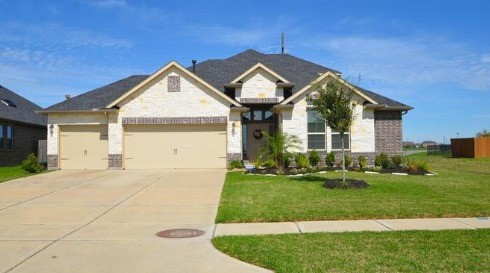 9111 Turnbull Lane Rosenberg, TX 77469 - Photo 2 of 29 a front view of a house with a yard