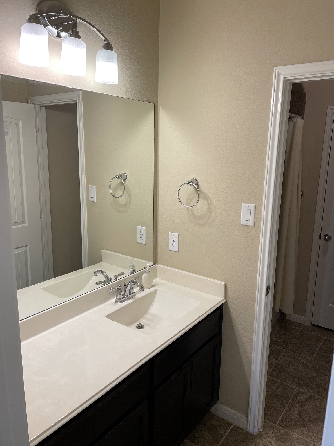 9111 Turnbull Lane Rosenberg, TX 77469 - Photo 22 of 29 a bathroom with a sink a mirror and a toilet