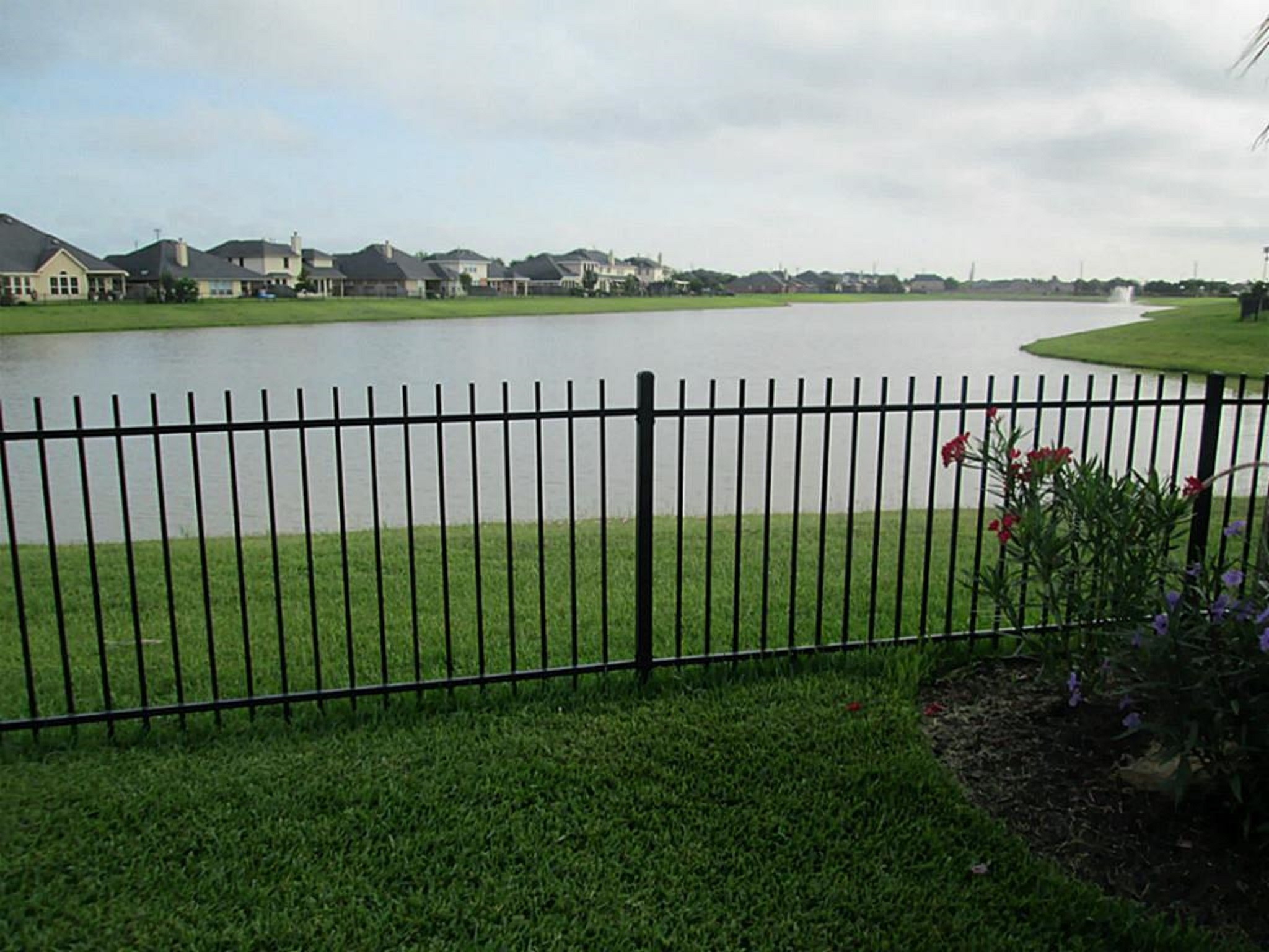 9111 Turnbull Lane Rosenberg, TX 77469 - Photo 23 of 29 a view of a lake from a yard
