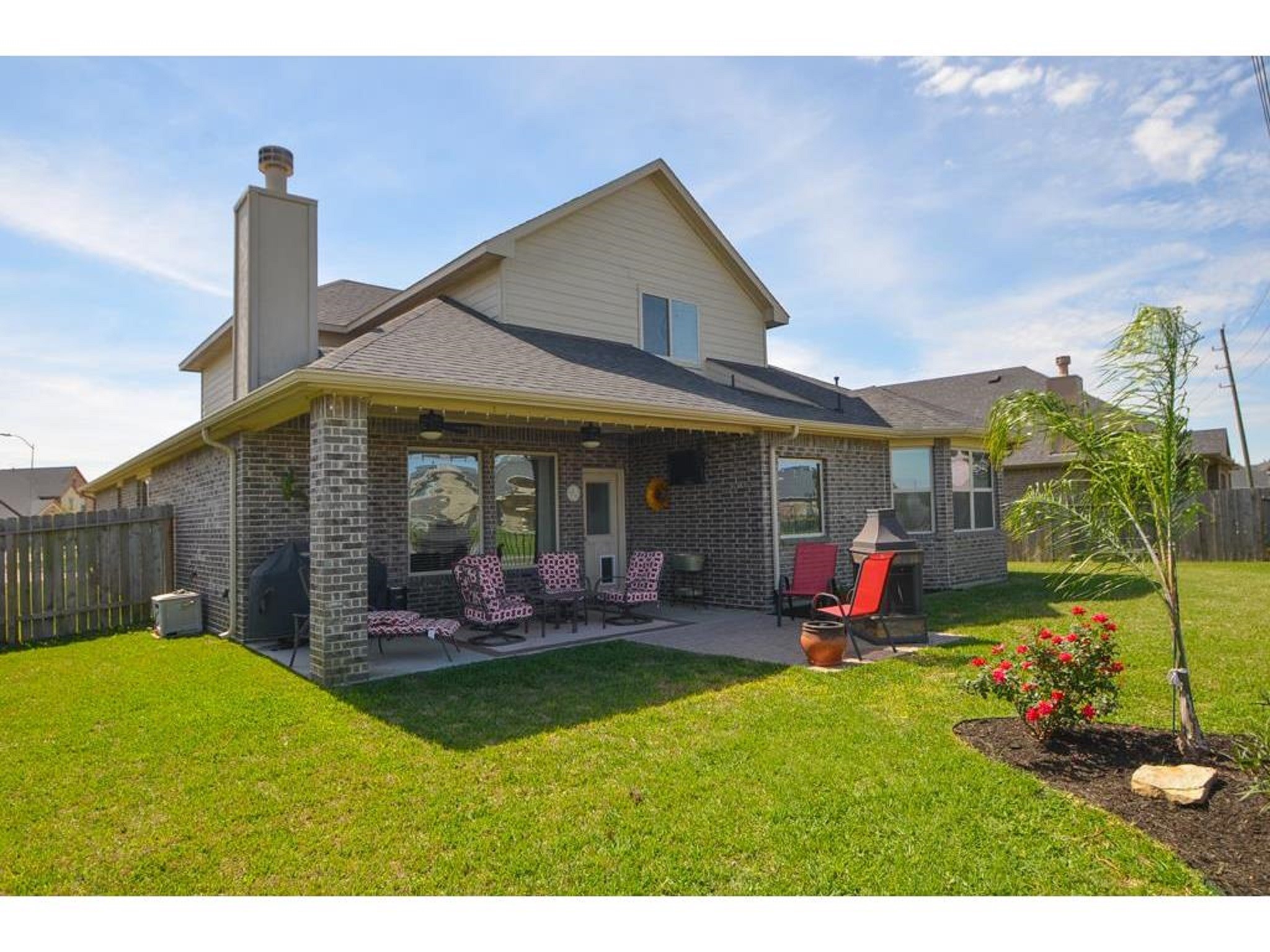 9111 Turnbull Lane Rosenberg, TX 77469 - Photo 24 of 29 a front view of a house with a garden and patio