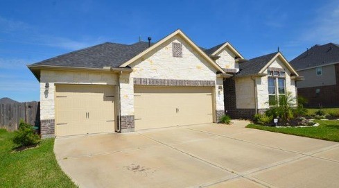 9111 Turnbull Lane Rosenberg, TX 77469 - Photo 3 of 29 a view of a house with a yard