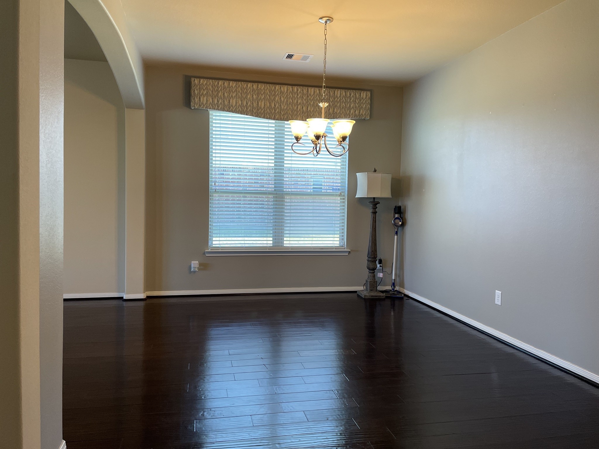 9111 Turnbull Lane Rosenberg, TX 77469 - Photo 5 of 29 an empty room with wooden floor and windows