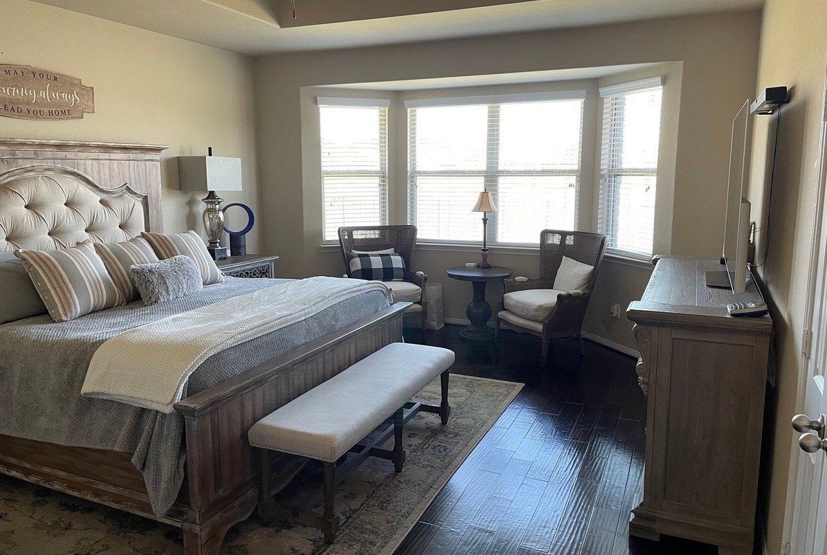 9111 Turnbull Lane Rosenberg, TX 77469 - Photo 6 of 29 a bedroom with a bed and a couch