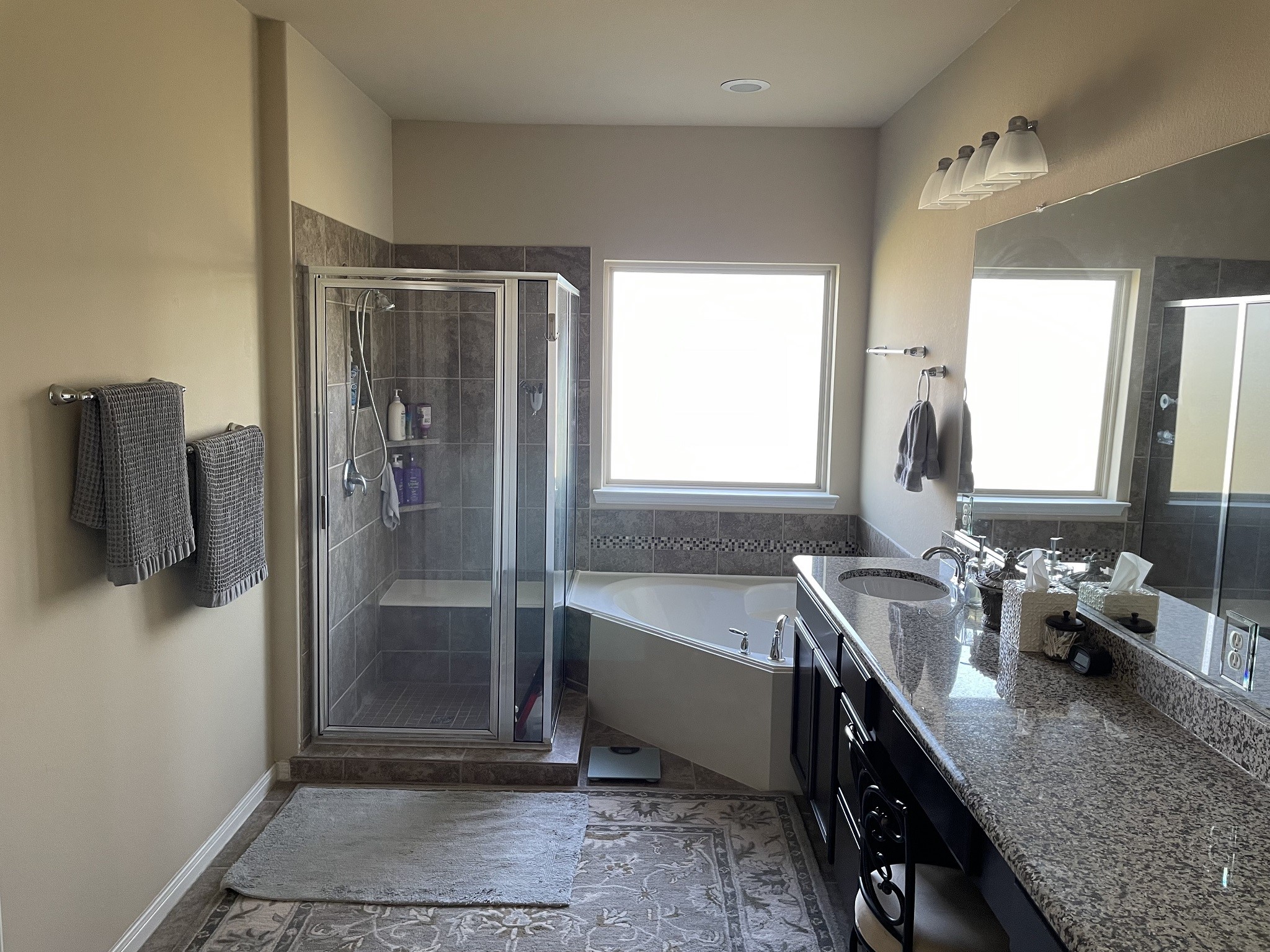 9111 Turnbull Lane Rosenberg, TX 77469 - Photo 8 of 29 a bathroom with a tub sink and mirror