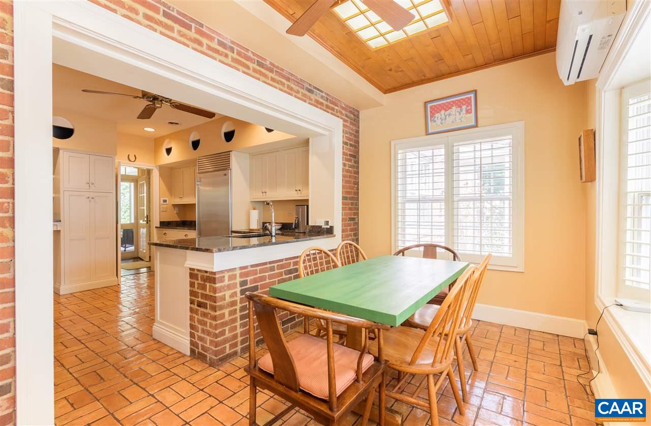 1931 Thomson Road Charlottesville, VA 22903 - Photo 10 of 42 a dining room with a table and chairs